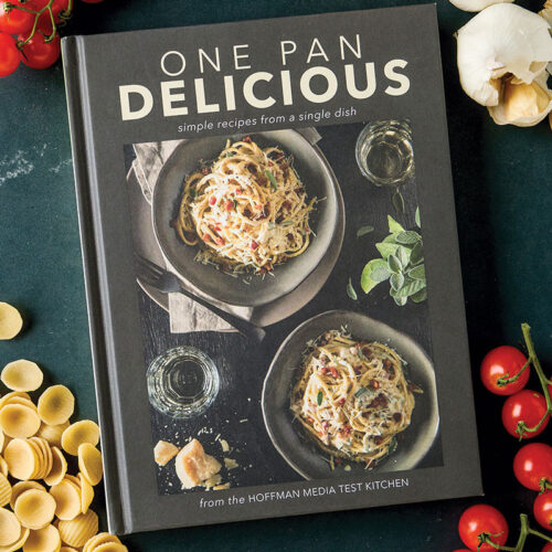One Pan Delicious Styled Cover with garlic, tomatoes, and pasta