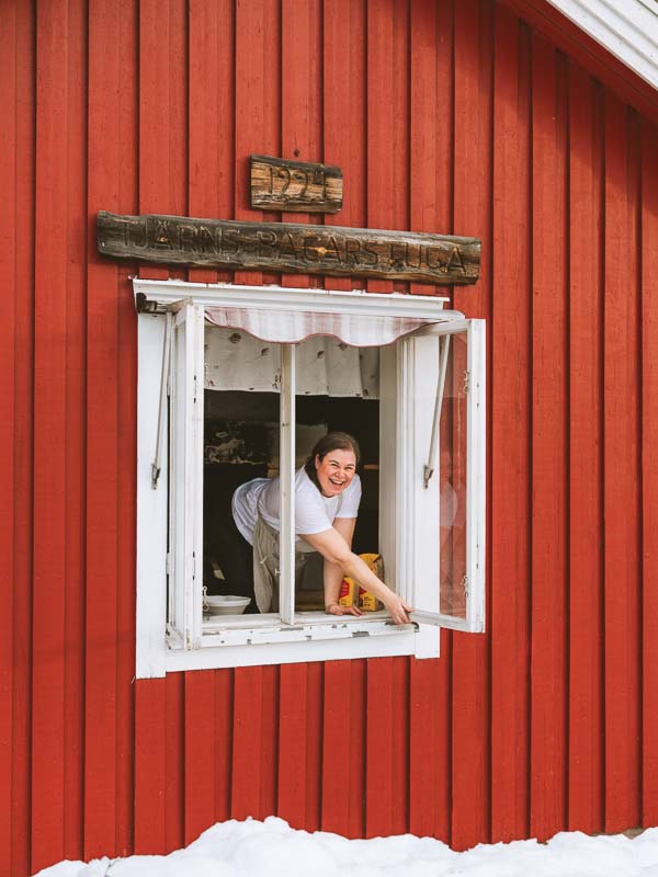 Franny in window of bakers cottage