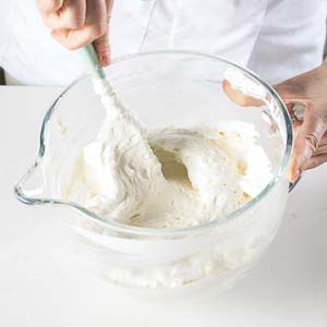 mixing flour and meringue