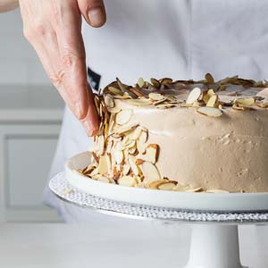 adding almonds to cake