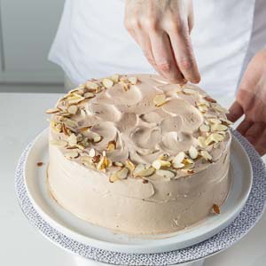 adding almonds to cake
