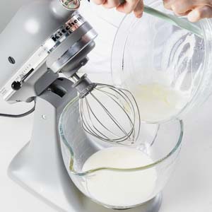 adding mixture to mixer