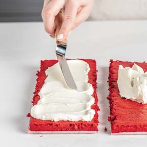 Spreading frosting on cake