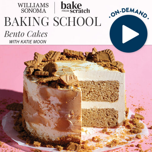 Promotional banner for Williams-Sonoma Baking School showing a pink-background, layered cake with cookie crumbles and a video play button icon at top right.