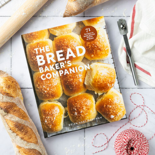 Bread Baker's Companion style cover with rolling pin and bread loaf