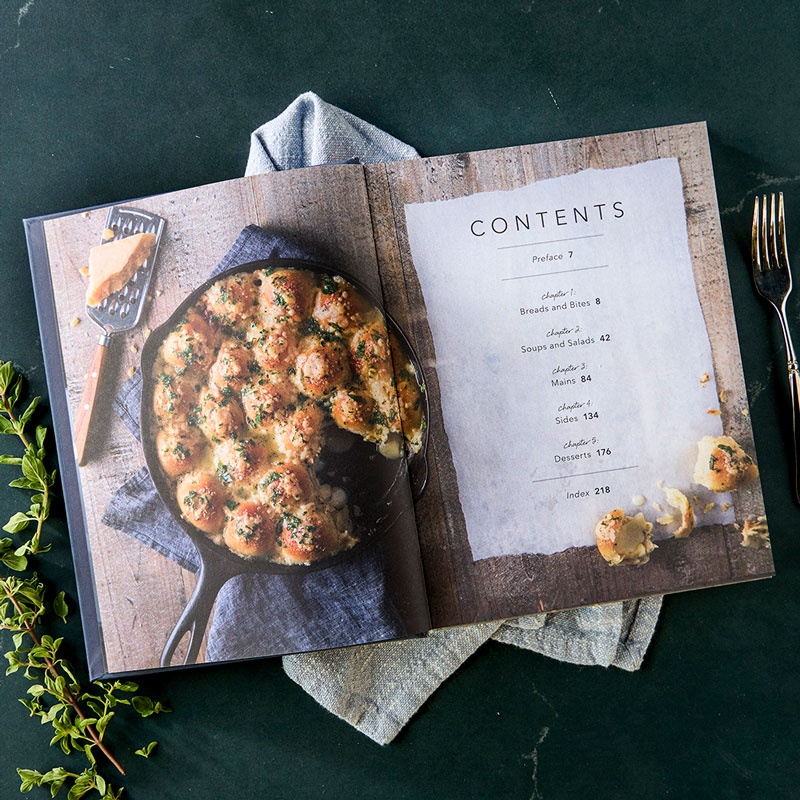 Comfort Made Delicious styled table of contents with napkin and herbs