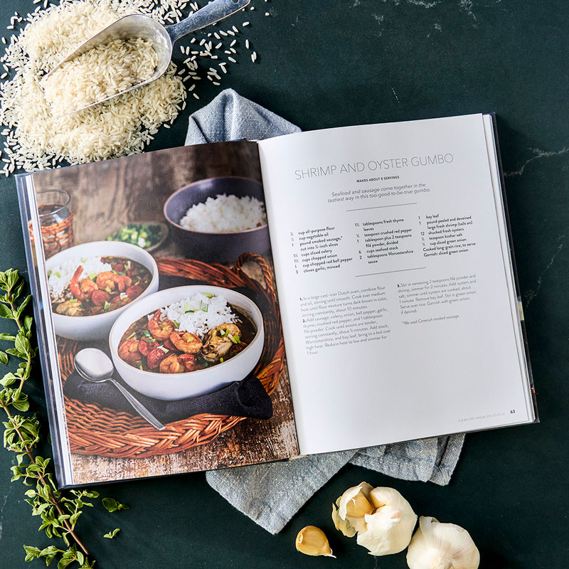 Comfort Made Delicious styled internal spreads with garlic, napkin, greens, and rice