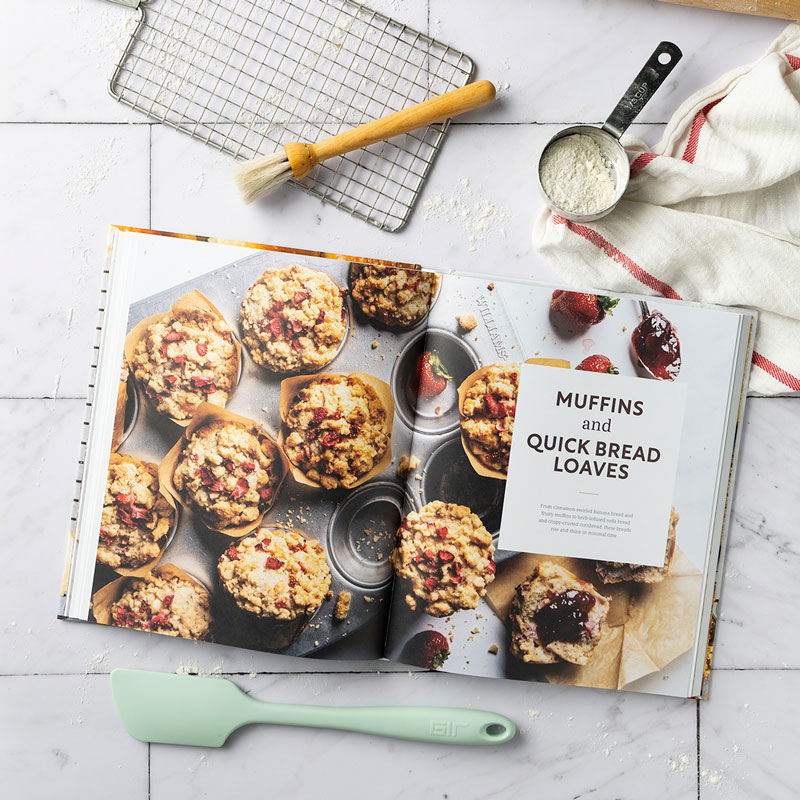 800x800Muffins-and-Quick-Bread-Loaves-Opener013KG - Bake from Scratch Bread Baker's Companion chapter opener with mint spatula, pastry brush, wire rack, and red/white stripe towel