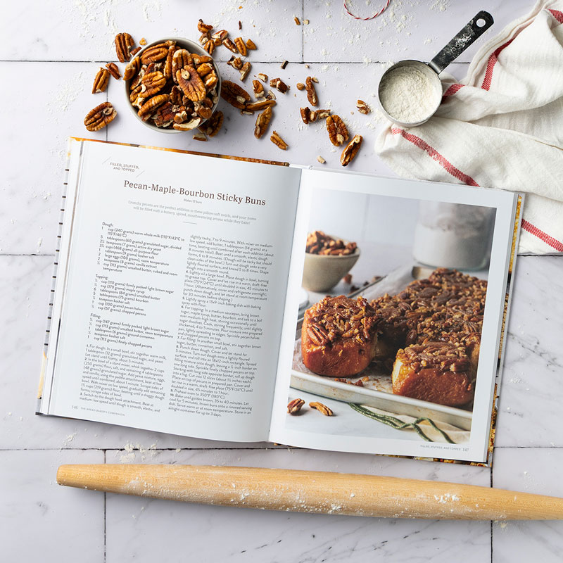 800x800Pecan-Maple-Bourbon-Sticky-Buns019KG - Bake from Scratch Bread Baker's Companion internal spread with rolling pin and pecans