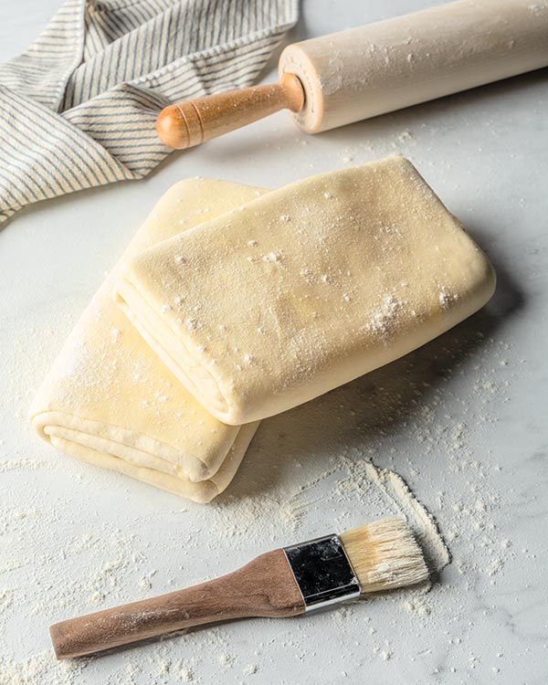 Folded laminated dough with a rolling pin