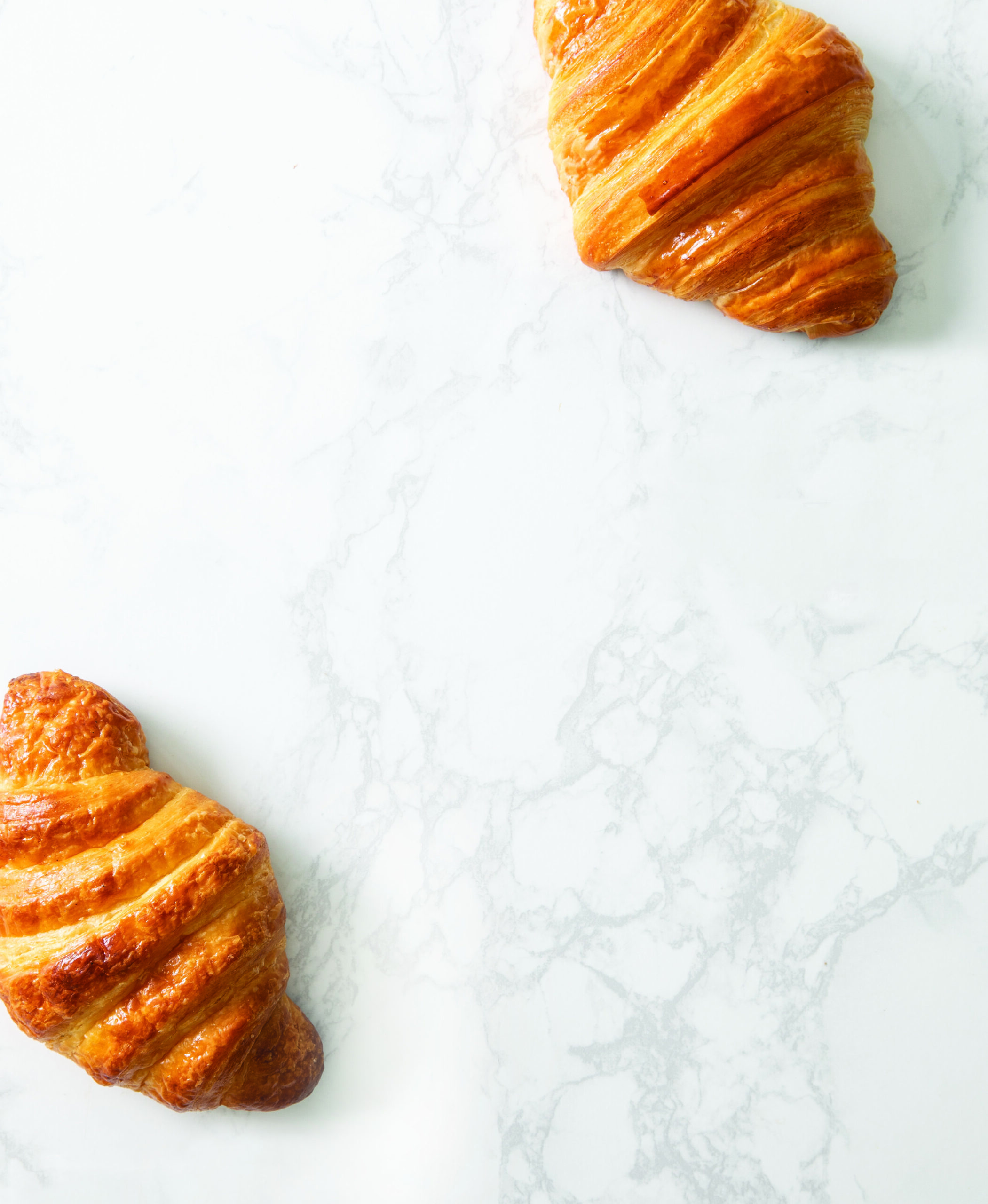 Fresh croissants with negative space