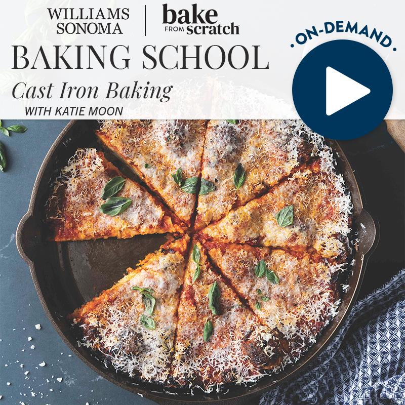 06_Summer-26_Cast-Iron-Baking - Bake from Scratch Cast-iron skillet pizza topped with cheese and basil, used as a baking school banner.