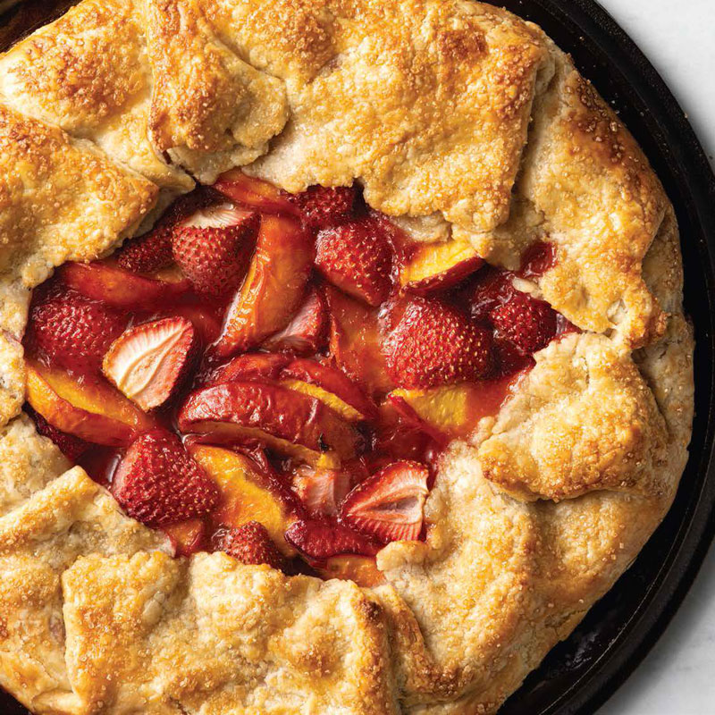 800x800BFS_WS_195_83_LR-copy_Page_1_Image_0001 - Bake from Scratch Strawberry-peach galette with a flaky, golden crust baked in a dark pie pan.