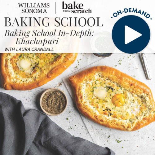 Promo image for Williams Sonoma Bake from Scratch: Baking School In-Depth—Khachapuri with Laura Crandall; two cheesy breads on a countertop with an on-demand video play button.