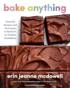 Cover of the cookbook Bake Anything by Erin Jeanne McDowell, with chocolate brownies and a rainbow title at the top.