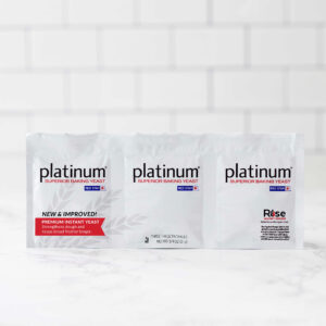 Three white yeast-packaging boxes labeled 'platinum' with 'Superior Baking Yeast' and a Red Star logo; Rise Against Hunger branding appears on the right.