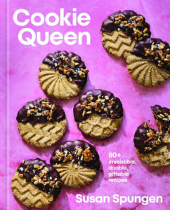 Cover of the book 'Cookie Queen' showing chocolate-topped cookies on a pink background; author Susan Spungen at bottom right.